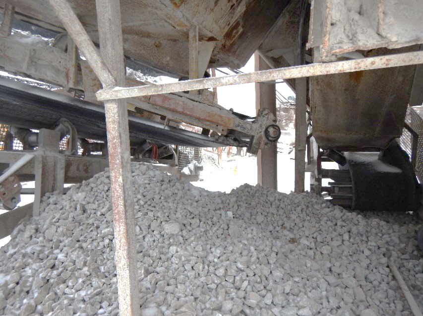 Photograph of the accident scene showing the tail pulley area without guarding